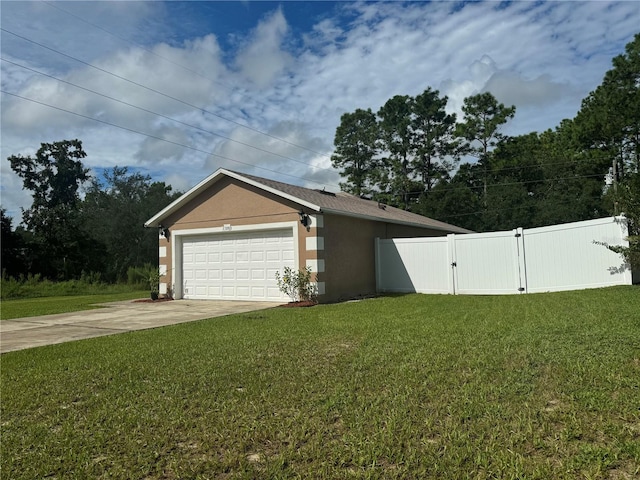 garage featuring a lawn