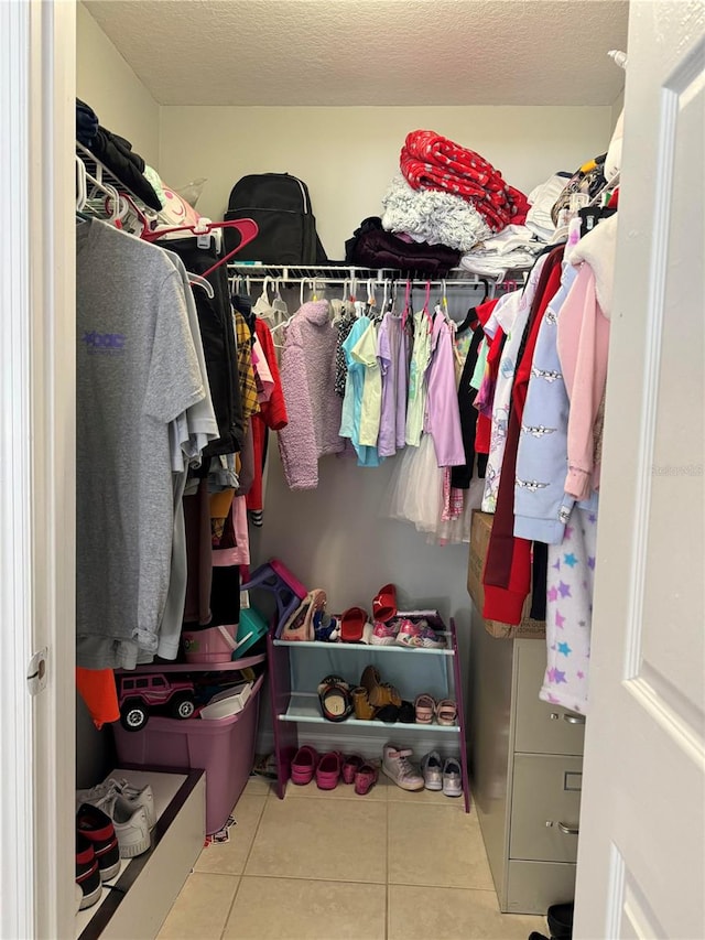 walk in closet featuring light tile patterned floors