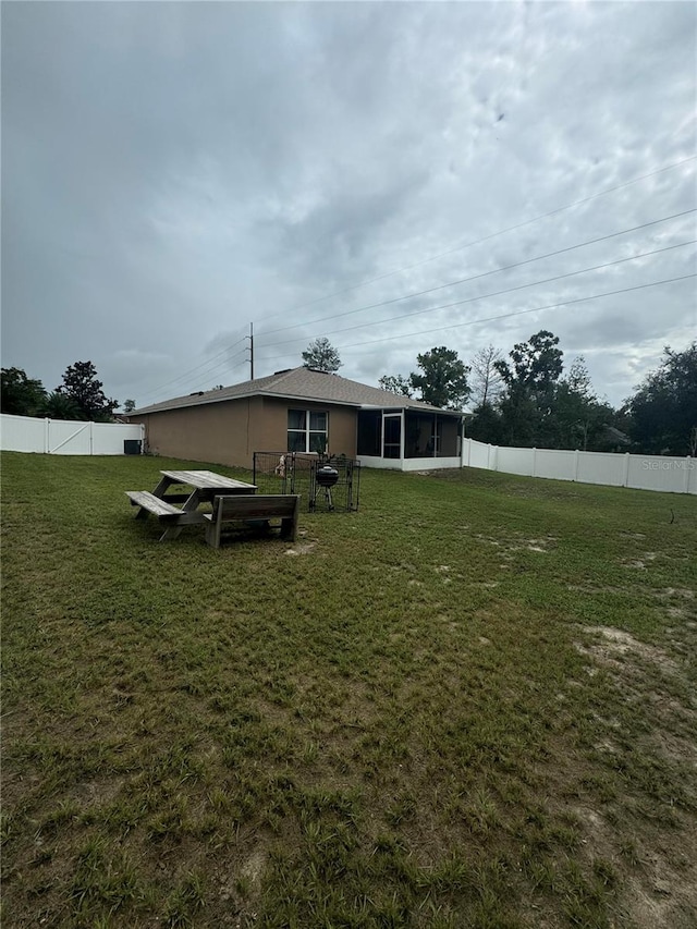 view of yard with a sunroom