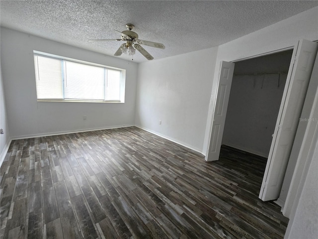 unfurnished bedroom with a closet, dark wood-style flooring, and a textured ceiling
