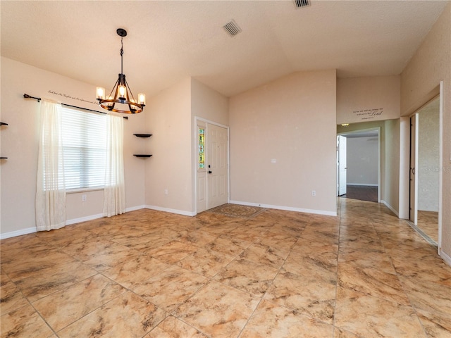 interior space featuring a textured ceiling, lofted ceiling, and a notable chandelier