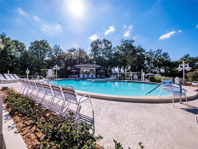 view of swimming pool featuring a patio area