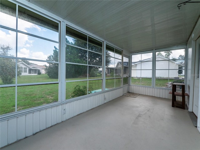 unfurnished sunroom with plenty of natural light