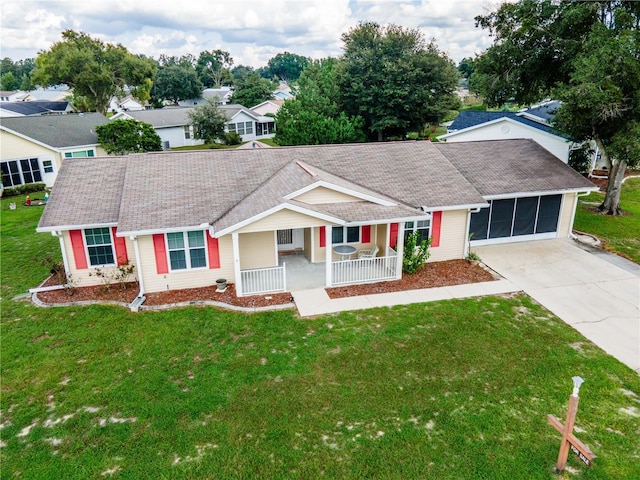 single story home with a porch and a front lawn