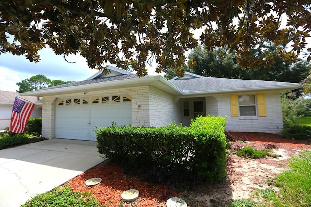 ranch-style house featuring a garage