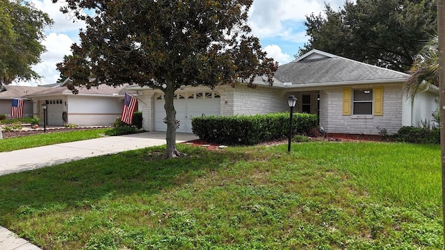 ranch-style home with a front yard and a garage