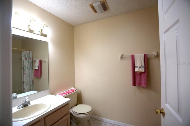 bathroom featuring a textured ceiling, vanity, curtained shower, toilet, and tile patterned floors