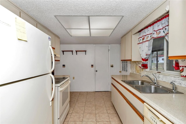 kitchen featuring sink, white appliances, and light tile patterned floors