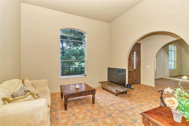 living room featuring lofted ceiling