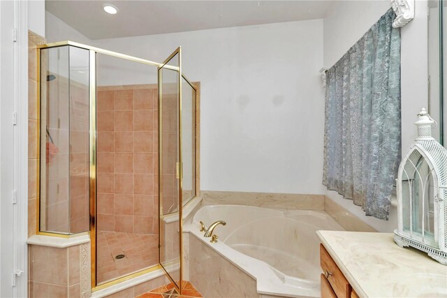 bathroom featuring vanity and separate shower and tub