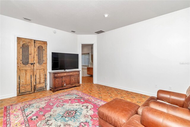 living room featuring light tile patterned floors