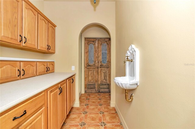 kitchen with light tile patterned flooring