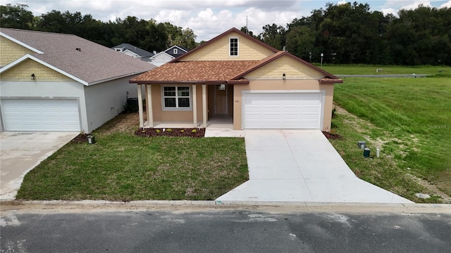 single story home with a garage and a front yard