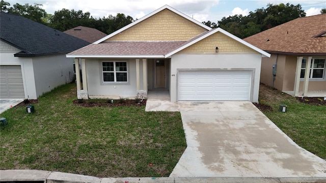 view of front facade with a front lawn and a garage