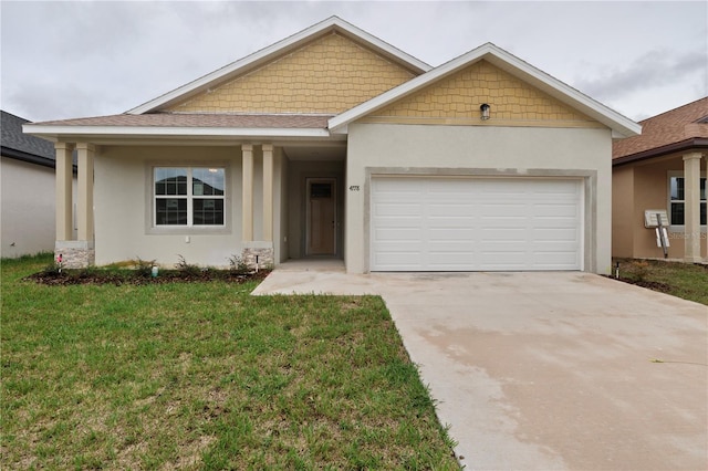 view of front of home featuring a garage and a front yard