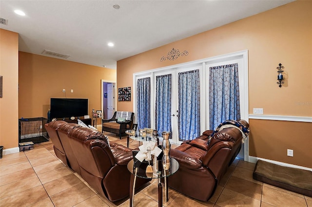 tiled living room featuring french doors