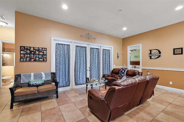 living room with light tile patterned floors and french doors