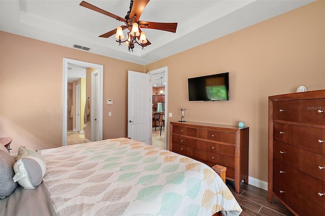 bedroom with ceiling fan and dark hardwood / wood-style flooring