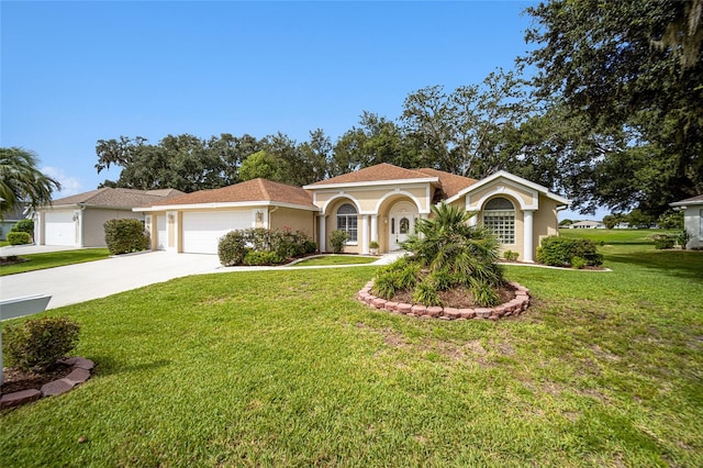 view of front of home featuring a garage and a front lawn