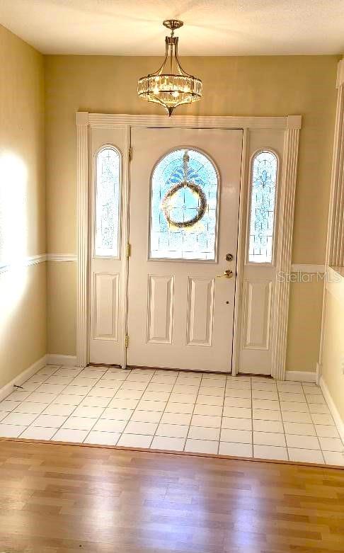 foyer entrance featuring light hardwood / wood-style flooring and plenty of natural light