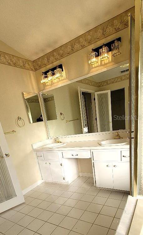 bathroom featuring tile patterned floors and vanity