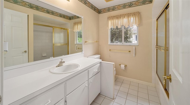 bathroom featuring tile patterned flooring, vanity, and toilet