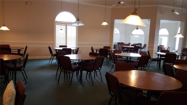 dining room with ceiling fan and crown molding