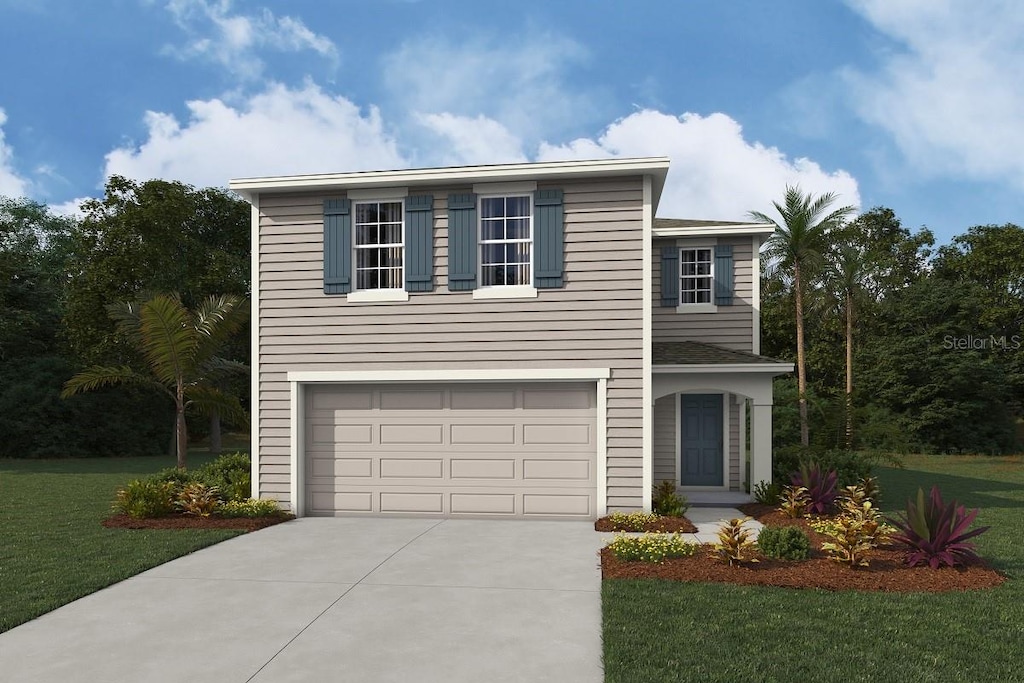 view of property featuring a garage and a front lawn