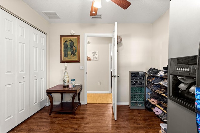 interior space featuring dark hardwood / wood-style floors and ceiling fan