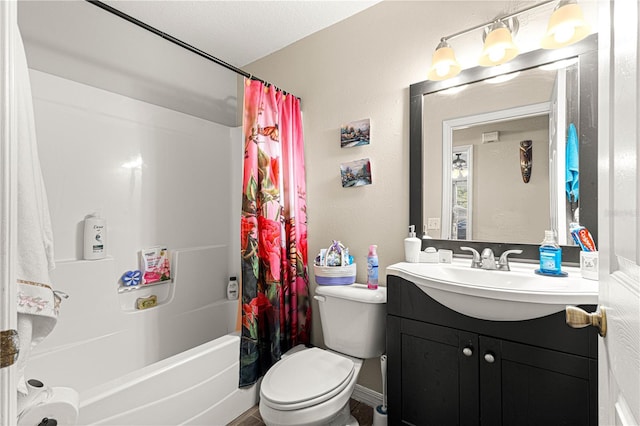 full bathroom featuring vanity, shower / tub combo, and toilet