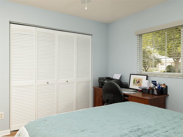 bedroom featuring a closet and a textured ceiling