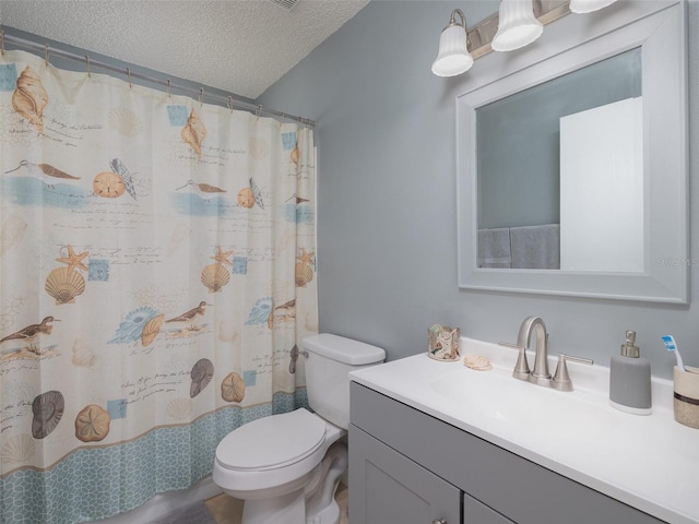 bathroom with a textured ceiling, vanity, toilet, and a shower with shower curtain