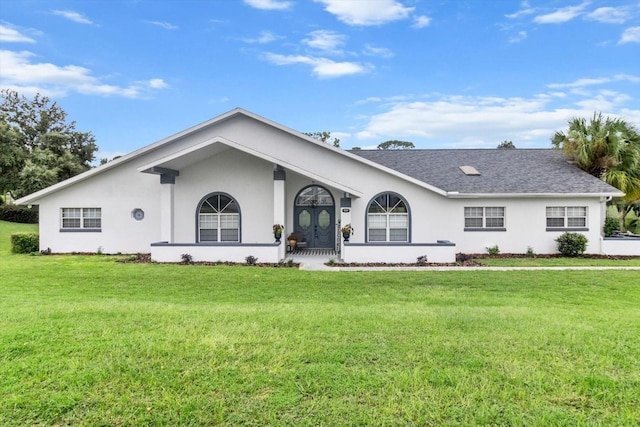 back of property featuring a yard