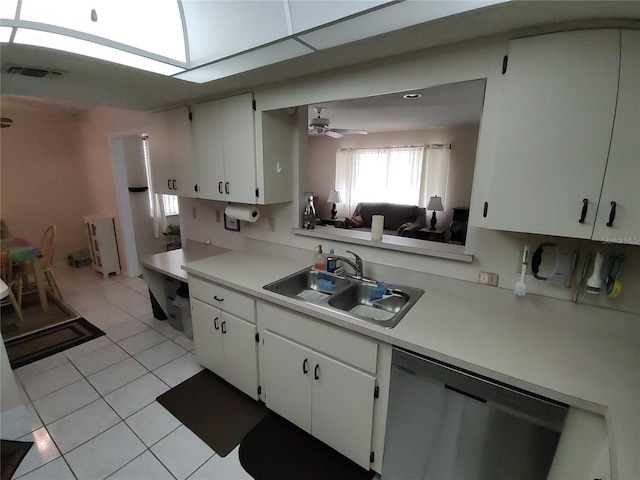 kitchen with visible vents, a sink, stainless steel dishwasher, white cabinetry, and light countertops