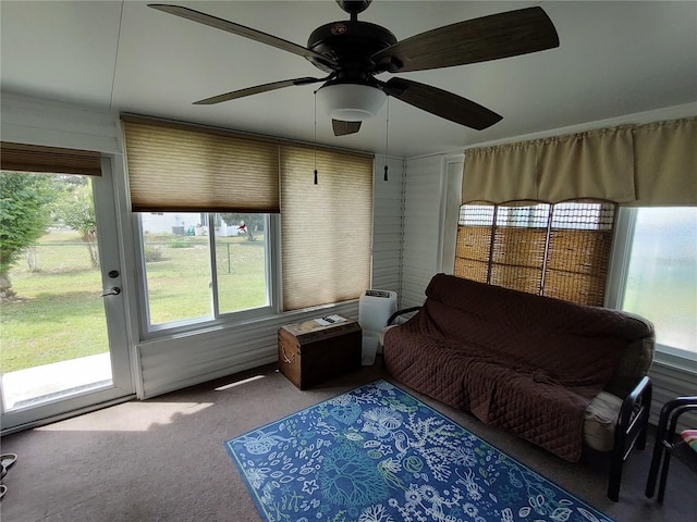 sunroom with plenty of natural light and a ceiling fan