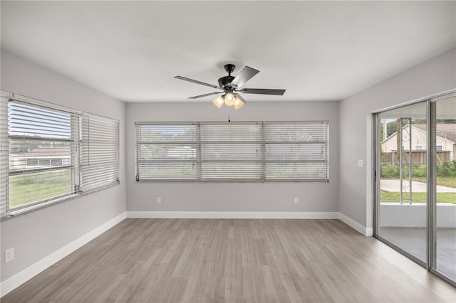 unfurnished room with ceiling fan and light hardwood / wood-style floors