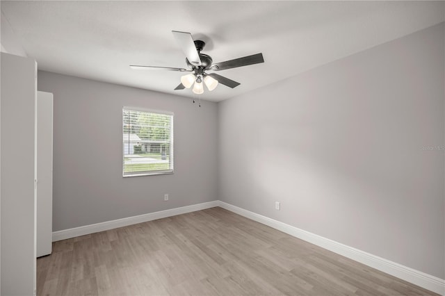 unfurnished room with light wood-type flooring and ceiling fan