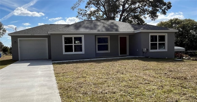 single story home with a garage and a front lawn