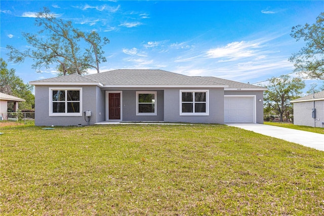 single story home featuring a garage and a front yard