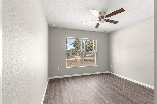 empty room featuring hardwood / wood-style floors, a textured ceiling, and ceiling fan