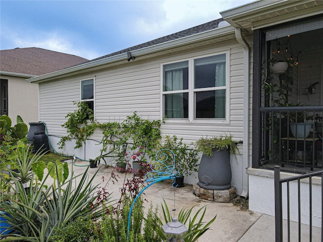 view of side of property featuring a patio