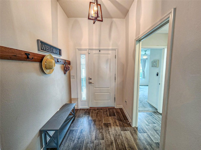 entrance foyer with a high ceiling and dark hardwood / wood-style flooring