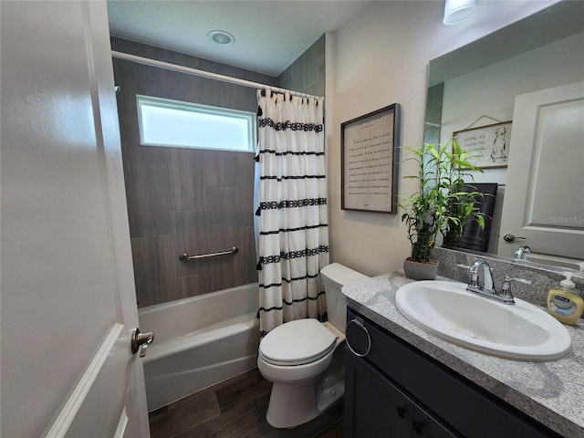 full bathroom with vanity, hardwood / wood-style floors, shower / bathtub combination with curtain, and toilet