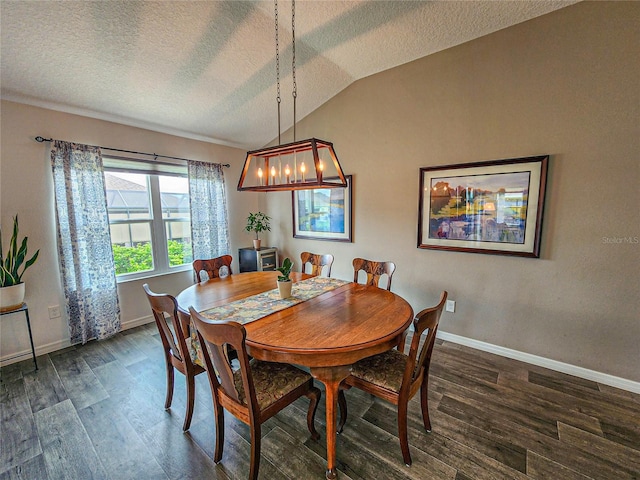 dining area featuring dark hardwood / wood-style floors, a textured ceiling, and vaulted ceiling