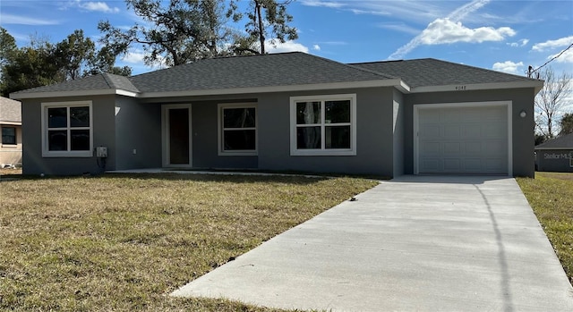 ranch-style house featuring a garage and a front yard