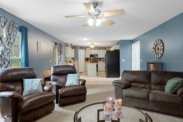 living room featuring ceiling fan and light carpet