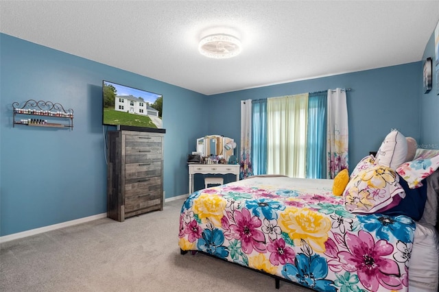 carpeted bedroom featuring a textured ceiling