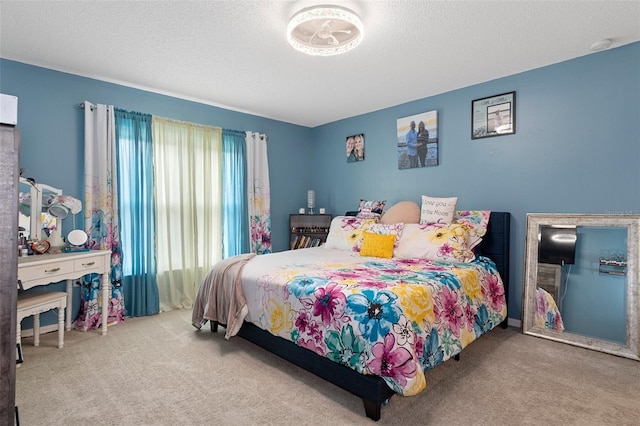 carpeted bedroom with multiple windows and a textured ceiling