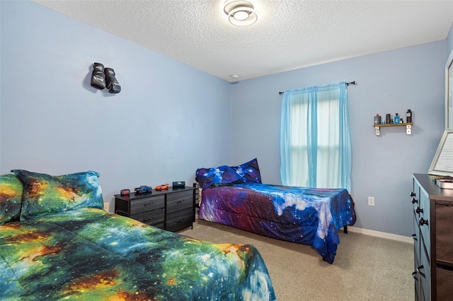 carpeted bedroom with a textured ceiling