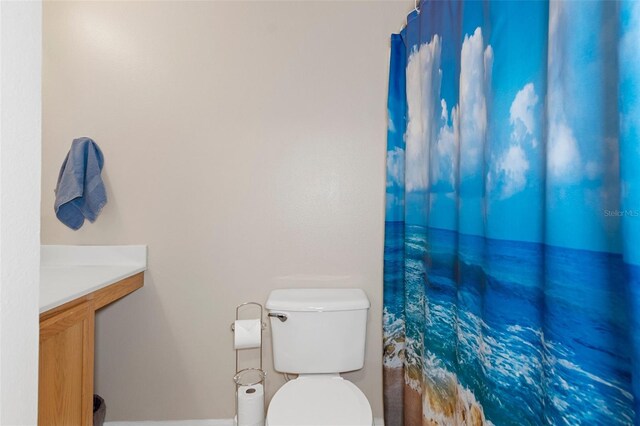 bathroom featuring toilet and vanity